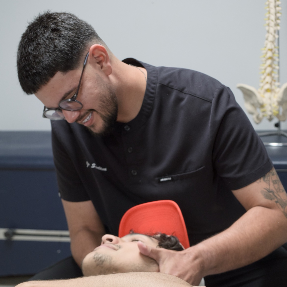 Max Chiropractic clinician providing hands-on cervical care